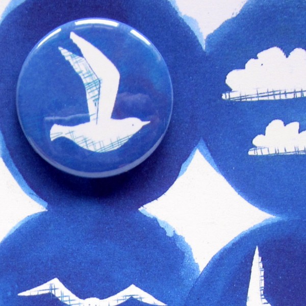 seaside seagulls and sun badge card