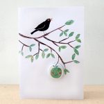 badge card with apple and blackbird by the black rabbit