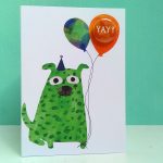 The black rabbit badge greetings card with balloon and dog