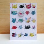 cat with badge greetings card by the black rabbit