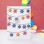 festive star garland greeting card with pin badge