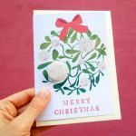 Mistletoe merry christmas card with pin badge by the black rabbit