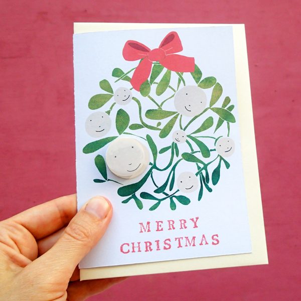 Mistletoe merry christmas card with pin badge by the black rabbit