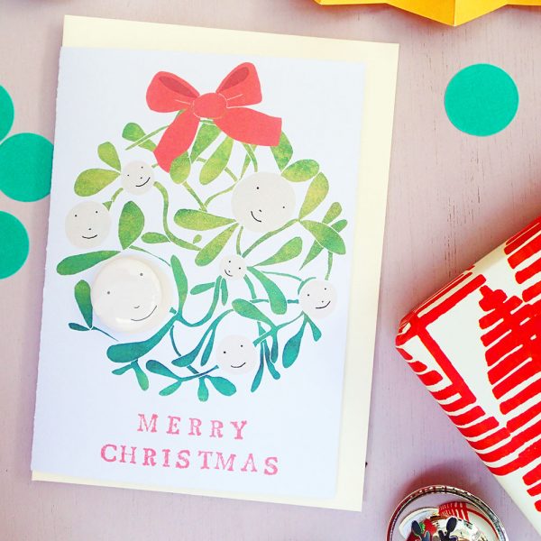 Mistletoe merry christmas card with pin badge by the black rabbit