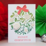 Mistletoe merry christmas card with pin badge by the black rabbit