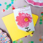pin badge on a card with a pink flower, bloomin brilliant, by the black rabbit
