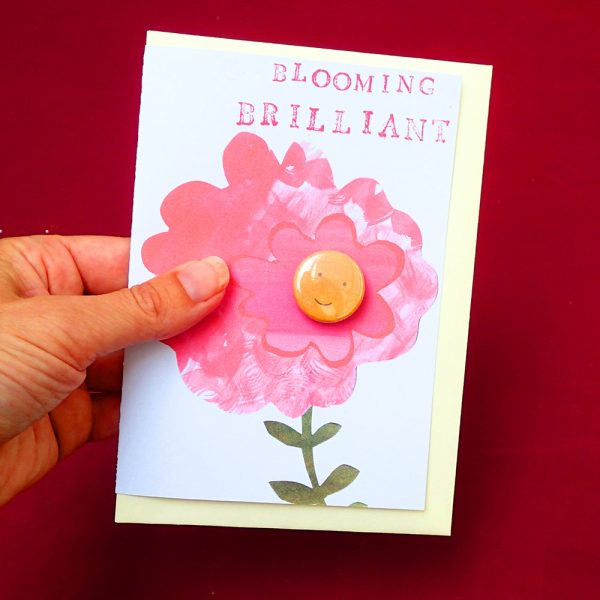 pin badge on a card with a pink flower, bloomin brilliant, by the black rabbit